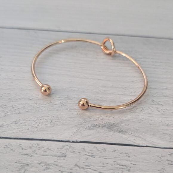 Gold Tone Cuff Bracelet with Knot Design - Picture 3 of 5